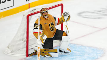 Oct 18, 2025; Las Vegas, Nevada, USA; Vegas Golden Knights goaltender Adin Hill (33) shouts towards his bench at the end of the third period against the Calgary Flames at T-Mobile Arena. Mandatory Credit: Stephen R. Sylvanie-Imagn Images