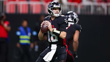 Dec 1, 2024; Atlanta, Georgia, USA; Atlanta Falcons quarterback Kirk Cousins (18) drops back to pass against the Los Angeles Chargers in the fourth quarter at Mercedes-Benz Stadium.