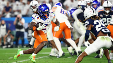 Dec 31, 2024; Glendale, AZ, USA; Boise State Broncos running back Ashton Jeanty (2) rushes the ball against the Penn State Nittany Lions during the second half in the Fiesta Bowl at State Farm Stadium. Mandatory Credit: Mark J. Rebilas-Imagn Images