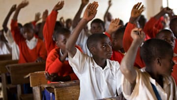 Tanzania - Iringa - School children put up their hands