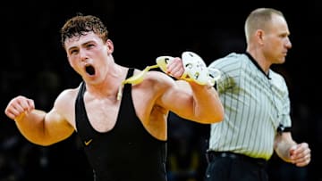 Iowa’s Michael Caliendo reacts after defeating Oklahoma State's Cameron Amine by major decision in a 165-pound match Sunday, Feb. 23, 2025 at Carver-Hawkeye Arena in Iowa City, Iowa.