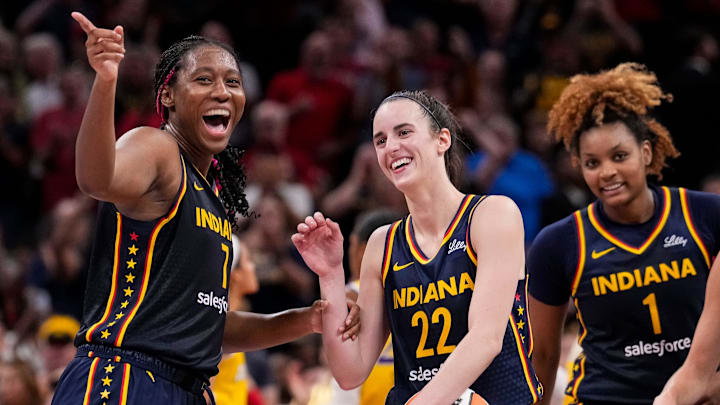 Indiana Fever forward Aliyah Boston (7) celebrates with Indiana Fever guard Caitlin Clark.