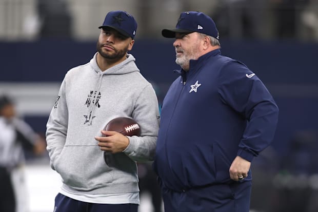 Dallas Cowboys quarterback Dak Prescott talks to head coach Mike McCarthy before the game against the Washington Commander