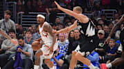 Apr 10, 2024; Los Angeles, California, USA; Phoenix Suns guard Bradley Beal (3) moves the ball against Los Angeles Clippers center Mason Plumlee (44) during the first half at Crypto.com Arena. Mandatory Credit: Gary A. Vasquez-Imagn Images