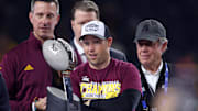 Dec 7, 2024; Arlington, TX, USA; Arizona State Sun Devils head coach Kenny Dillingham looks at the trophy after winning the Big 12 Championship game against the Iowa State Cyclones at AT&T Stadium. Mandatory Credit: Tim Heitman-Imagn Images