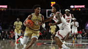 Nov 14, 2025; Athens, Georgia, USA; Georgia Tech Yellow Jackets guard Jaeden Mustaf (3) drives past against Georgia Bulldogs guard Marcus Millender (4) during the second half at Stegeman Coliseum. Mandatory Credit: Mady Mertens-Imagn Images