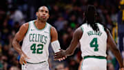 Jan 7, 2025; Denver, Colorado, USA; Boston Celtics center Al Horford (42) and guard Jrue Holiday (4) in the first quarter against the Denver Nuggets at Ball Arena. Mandatory Credit: Isaiah J. Downing-Imagn Images