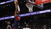 Nov 8, 2025; Washington, District of Columbia, USA; Washington Wizards center Alex Sarr (20) dunks the ball as Dallas Mavericks center Moussa Cisse (30) and Mavericks forward Naji Marshall (13) look on in the second half at Capital One Arena. Mandatory Credit: Geoff Burke-Imagn Images