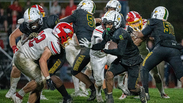 Northland's Amir Brown (2) attempts to run past the Big Walnut defense during their game at Northland High School.