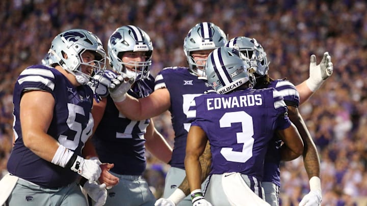 Aug 31, 2024; Manhattan, Kansas, USA; Kansas State Wildcats running back Dylan Edwards (3) is congratulated by teammates after scoring a touchdown in the third quarter against the Tennessee-Martin Skyhawks at Bill Snyder Family Football Stadium. Mandatory Credit: Scott Sewell-Imagn Images