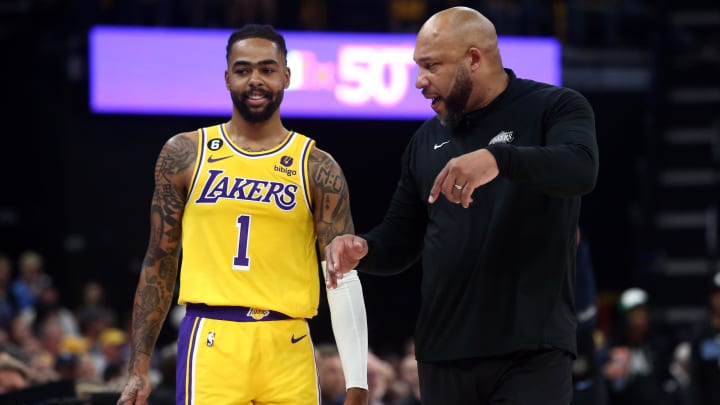 Apr 19, 2023; Memphis, Tennessee, USA; Los Angeles Lakers head coach Darvin Ham (right) talks with