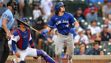 Aug 17, 2024; Chicago, Illinois, USA; Toronto Blue Jays third baseman Addison Barger (47) hits a home run during the ninth inning against the Chicago Cubs at Wrigley Field. Mandatory Credit: Patrick Gorski-Imagn Images