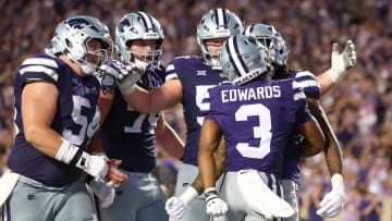 Aug 31, 2024; Manhattan, Kansas, USA; Kansas State Wildcats running back Dylan Edwards (3) is congratulated by teammates after scoring a touchdown in the third quarter against the Tennessee-Martin Skyhawks at Bill Snyder Family Football Stadium. Mandatory Credit: Scott Sewell-USA TODAY Sports