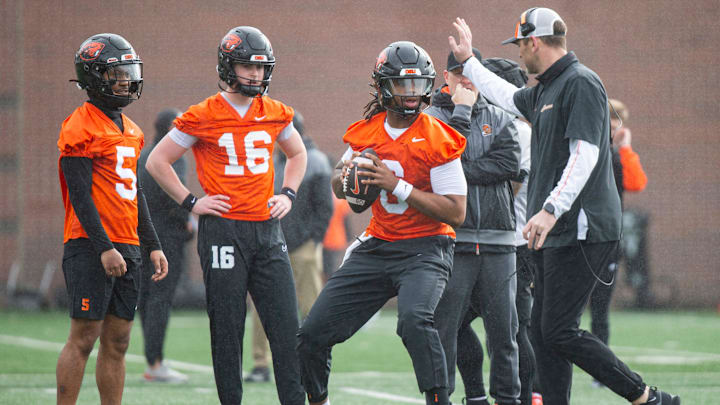 Oregon State offensive coordinator Ryan Gunderson, right, runs throwing drills with his quarterbacks during the first day of spring practice at the Tommy Prothro Football Complex on Tuesday, March 4, 2025, in Corvallis, Ore. Oregon State offensive coordinator Ryan Gunderson, right, runs throwing drills with his quarterbacks during the first day of spring practice at the Tommy Prothro Football Complex on Tuesday, March 4, 2025, in Corvallis, Ore.