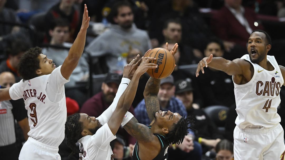 Dec 3, 2025; Cleveland, Ohio, USA; Portland Trail Blazers guard Caleb Love (2) shoots against Cleveland Cavaliers guard Craig Porter Jr. (9), guard Darius Garland (10) and center Evan Mobley (4) in the fourth quarter at Rocket Arena. Mandatory Credit: David Richard-Imagn Images Dec 3, 2025; Cleveland, Ohio, USA; Portland Trail Blazers guard Caleb Love (2) shoots against Cleveland Cavaliers guard Craig Porter Jr. (9), guard Darius Garland (10) and center Evan Mobley (4) in the fourth quarter at Rocket Arena. Mandatory Credit: David Richard-Imagn Images