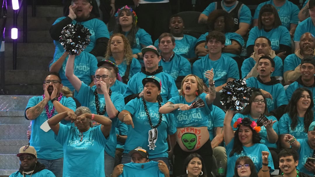 Apr 19, 2026; San Antonio, Texas, USA; San Antonio Spurs fan wears an alien on her stomach during the first half of game one of the first round of the 2026 NBA Playoffs against the Portland Trail Blazers at Frost Bank Center. Mandatory Credit: Scott Wachter-Imagn Images