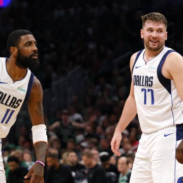 Jun 9, 2024; Boston, Massachusetts, USA; Dallas Mavericks guard Kyrie Irving (11) and guard Luka Doncic (77) react after a play against the Boston Celtics during the first quarter in game two of the 2024 NBA Finals at TD Garden. Mandatory Credit: Peter Casey-USA TODAY Sports
