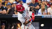 Arkansas Razorbacks center fielder Justin Thomas Jr. (4) hits a two RBI single against the LSU Tigers during the ninth inning at Charles Schwab Field. 