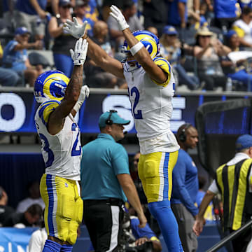Sep 7, 2025; Inglewood, California, USA; Los Angeles Rams running back Kyren Williams (23) and Los Angeles Rams wide receiver Puka Nacua (12) celebrate after Los Angeles Rams running back Kyren Williams (23) scored a touchtown during the second quarter at SoFi Stadium. Mandatory Credit: Kiyoshi Mio-Imagn Images