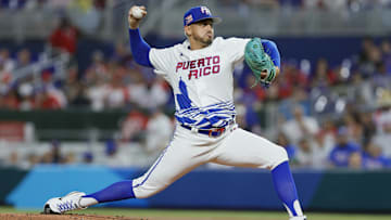 Mar 13, 2023; Miami, Florida, USA; Puerto Rico starting pitcher pitcher Jose De Leon (87) delivers a pitch during the first inning against Israel at LoanDepot Park. Mandatory Credit: Sam Navarro-Imagn Images