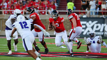 Sep 16, 2023; Lubbock, Texas, USA;  Texas Tech Red Raiders quarterback Tyler Shough (12) runs the ball against Tarleton State Texans defensive back Devin Sterling (12) in the first half at Jones AT&T Stadium and Cody Campbell Field. Mandatory Credit: Michael C. Johnson-Imagn Images