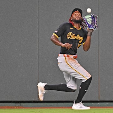 Jul 9, 2025; Kansas City, Missouri, USA;  Pittsburgh Pirates center fielder Oneil Cruz (15) catches a fly ball in the eighth inning against the Kansas City Royals at Kauffman Stadium. Mandatory Credit: Peter Aiken-Imagn Images