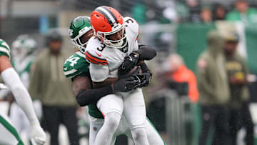 Nov 9, 2025; East Rutherford, New Jersey, USA; Cleveland Browns wide receiver Jerry Jeudy (3) is tackled by New York Jets linebacker Jamien Sherwood (44) during the first half at MetLife Stadium. Mandatory Credit: Vincent Carchietta-Imagn Images