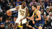 Jan 27, 2024; San Francisco, California, USA; Los Angeles Lakers forward LeBron James (23) dribbles against Golden State Warriors guard Klay Thompson (right) during the fourth quarter at Chase Center. Mandatory Credit: Darren Yamashita-USA TODAY Sports
