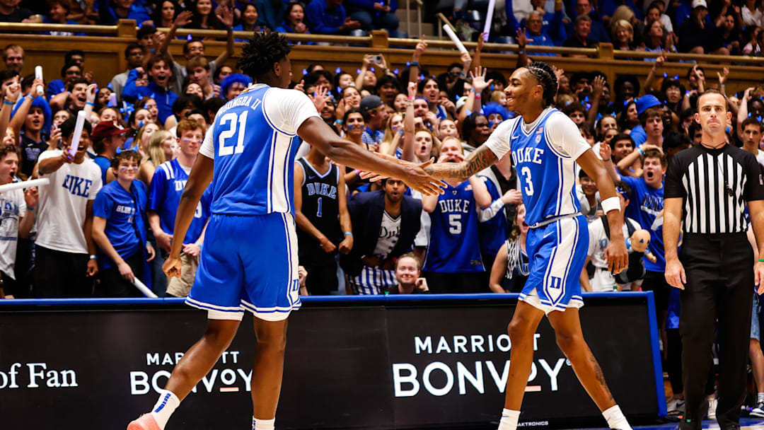 Oct 3, 2025; Durham, NC, USA; Duke Blue Devils center Patrick Ngongba II (21) and guard Isaiah Evans (3) celebrate during the Countdown to Craziness at the Cameron Indoor Stadium. 