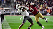 Nov 15, 2025; Chestnut Hill, Massachusetts, USA; Georgia Tech Yellow Jackets wide receiver Eric Rivers (3) catches the ball while Boston College Eagles defensive back Max Tucker (3) defends during the second half at Alumni Stadium. Mandatory Credit: Bob DeChiara-Imagn Images