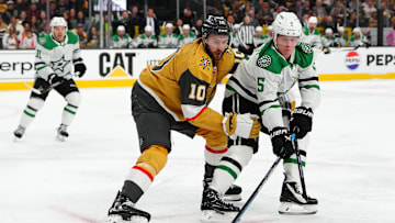 Apr 29, 2024; Las Vegas, Nevada, USA; Dallas Stars defenseman Nils Lundkvist (5) keeps the puck away from Vegas Golden Knights center Nicolas Roy (10) during the first period of game four of the first round of the 2024 Stanley Cup Playoffs at T-Mobile Arena. Mandatory Credit: Stephen R. Sylvanie-USA TODAY Sports