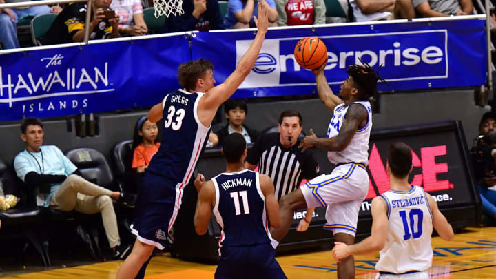 Nov 22, 2023; Honolulu, HI, USA; UCLA Bruins guard Dylan Andrews (2) drives to the basket with shot blocked by Gonzaga Bulldogs forward Ben Gregg (33) during the first period at SimpliFi Arena at Stan Sheriff Center. Mandatory Credit: Steven Erler-USA TODAY Sports