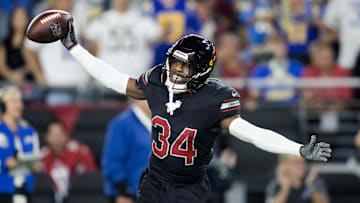 Oct 21, 2024; Glendale, Arizona, USA; Arizona Cardinals safety Jalen Thompson (34) celebrates after recovering a fumble from the Los Angeles Chargers in the first half at State Farm Stadium. Mandatory Credit: Mark J. Rebilas-Imagn Images