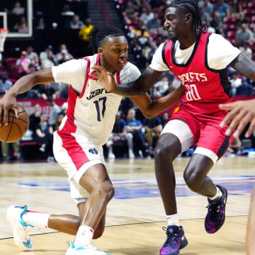 Jul 14, 2024; Las Vegas, NV, USA; Washington Wizards guard Bub Carrington (17) dribbles against Houston Rockets guard Kira Lewis Jr (60) during the first quarter at Thomas & Mack Center. Mandatory Credit: Stephen R. Sylvanie-USA TODAY Sports