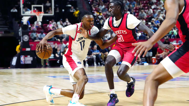 Jul 14, 2024; Las Vegas, NV, USA; Washington Wizards guard Bub Carrington (17) dribbles against Houston Rockets guard Kira Lewis Jr (60) during the first quarter at Thomas & Mack Center. Mandatory Credit: Stephen R. Sylvanie-USA TODAY Sports