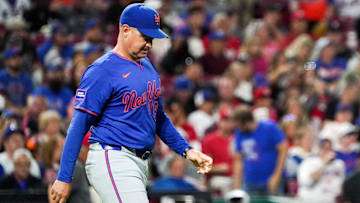 Sep 6, 2025; Cincinnati, Ohio, USA; New York Mets manager Carlos Mendoza (64) walks to the pitchers mound in the seventh inning of a MLB game between the Cincinnati Reds and New York Mets, Saturday, Sept. 6, 2025, at Great American Ball Park in downtown Cincinnati. Reds won 6-3.