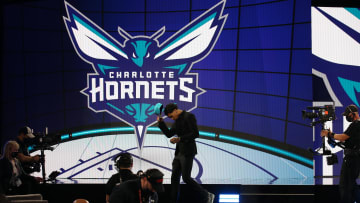 Jul 29, 2021; Brooklyn, New York, USA; James Bouknight (Connecticut) walks off the stage after being selected as the number eleven overall pick by the Charlotte Hornets in the first round of the 2021 NBA Draft at Barclays Center. Mandatory Credit: Brad Penner-USA TODAY Sports