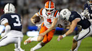 Sep 28, 2024; University Park, Pennsylvania, USA; Illinois Fighting Illini quarterback Luke Altmyer (9) runs while trying against Penn State Nittany Lions linebacker Tyler Elsdon (43) during the second quarter at Beaver Stadium. Mandatory Credit: Matthew O'Haren-Imagn Images