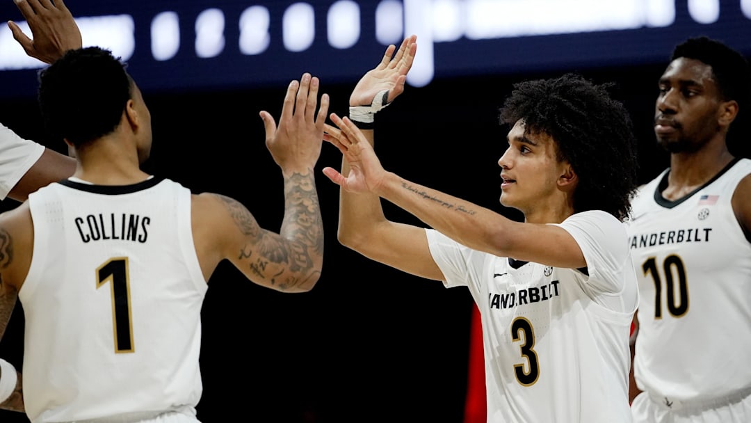 Vanderbilt guard Tyler Tanner (3) celebrates with Frankie Collins (1) during the second half of an NCAA college basketball game against SMU Wednesday, Dec. 3, 2025, in Nashville, Tenn. Vanderbilt won 88-69.