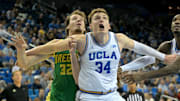 Dec 6, 2025; Los Angeles, California, USA;  UCLA Bruins forward Tyler Bilodeau (34) boxes out Oregon Ducks center Nate Bittle (32) during the second half at Pauley Pavilion presented by Wescom Financial. Mandatory Credit: Jayne Kamin-Oncea-Imagn Images