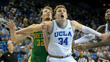 Dec 6, 2025; Los Angeles, California, USA;  UCLA Bruins forward Tyler Bilodeau (34) boxes out Oregon Ducks center Nate Bittle (32) during the second half at Pauley Pavilion presented by Wescom Financial. Mandatory Credit: Jayne Kamin-Oncea-Imagn Images