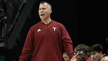 Troy coach Scott Cross calls to his team during the game against Oregon at Matthew Knight Arena in Eugene.