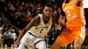 Jan 18, 2025; Nashville, Tennessee, USA;  Vanderbilt Commodores guard Jason Edwards (1) dribbles past Tennessee Volunteers guard Bishop Boswell (3). during the first half at Memorial Gymnasium. Mandatory Credit: Steve Roberts-Imagn Images