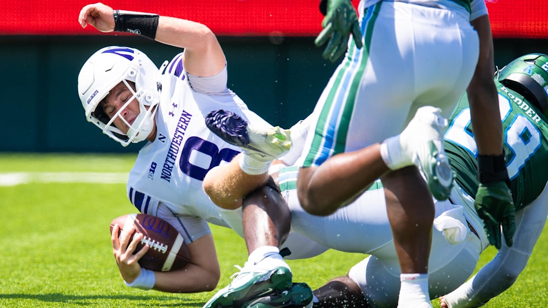 Aug 30, 2025; New Orleans, Louisiana, USA; Northwestern Wildcats quarterback Preston Stone (8) has to scramble out the pocket but is sacked by Tulane Green Wave defensive lineman Santana Hopper (29) during the second half at Yulman Stadium. Mandatory Credit: Stephen Lew-Imagn Images Aug 30, 2025; New Orleans, Louisiana, USA; Northwestern Wildcats quarterback Preston Stone (8) has to scramble out the pocket but is sacked by Tulane Green Wave defensive lineman Santana Hopper (29) during the second half at Yulman Stadium. Mandatory Credit: Stephen Lew-Imagn Images