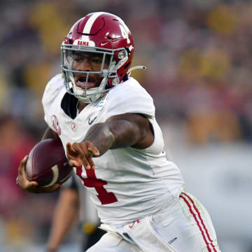 Jan 1, 2024; Pasadena, CA, USA; Alabama Crimson Tide quarterback Jalen Milroe (4) runs in the fourth quarter against the Michigan Wolverines  in the 2024 Rose Bowl college football playoff semifinal game at Rose Bowl. Mandatory Credit: Gary A. Vasquez-USA TODAY Sports