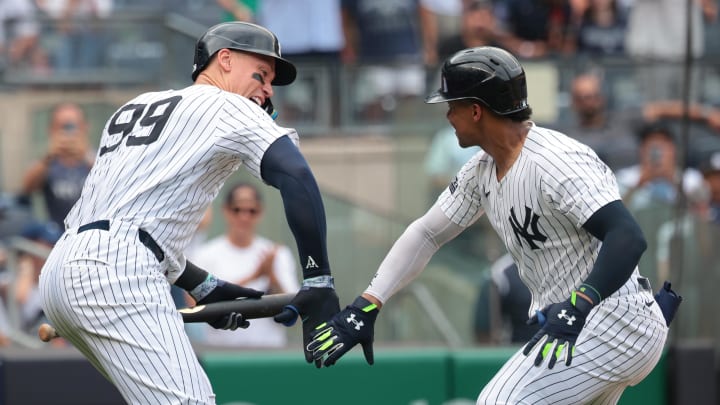 Aug 4, 2024; Bronx, New York, USA;  New York Yankees right fielder Juan Soto (22) celebrates his solo home run during the seventh inning against the Toronto Blue Jays with left fielder Aaron Judge (99) at Yankee Stadium. Mandatory Credit: Vincent Carchietta-USA TODAY Sports