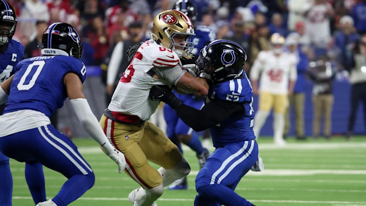 Dec 22, 2025; Indianapolis, Indiana, USA; Indianapolis Colts defensive end Samson Ebukam (52) tackles San Francisco 49ers tight end George Kittle (85) in the second quarter of the game at Lucas Oil Stadium. Mandatory Credit: Trevor Ruszkowski-Imagn Images