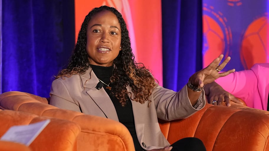 Orlando Pride assistant coach Yolanda Thomas talks at a soccer conference.  | Ray Acevedo-Imagn Images