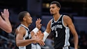 Oct 13, 2025; Indianapolis, Indiana, USA; San Antonio Spurs forward/guard Keldon Johnson (3) and forward/center Victor Wembanyama (1) celebrate a made basket in the second half against the Indiana Pacers at Gainbridge Fieldhouse.