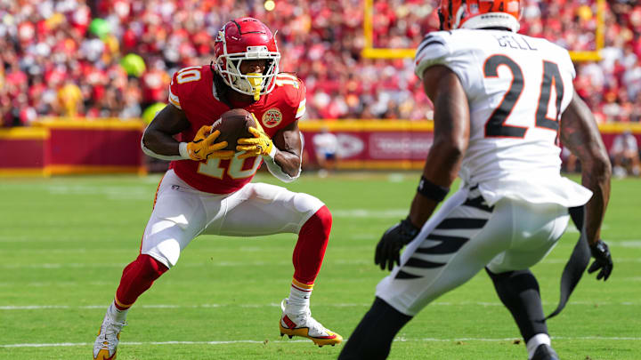 Sep 15, 2024; Kansas City, Missouri, USA; Kansas City Chiefs running back Isiah Pacheco (10) catches a pass against Cincinnati Bengals safety Vonn Bell (24) at GEHA Field at Arrowhead Stadium. Mandatory Credit: Jay Biggerstaff-Imagn Images